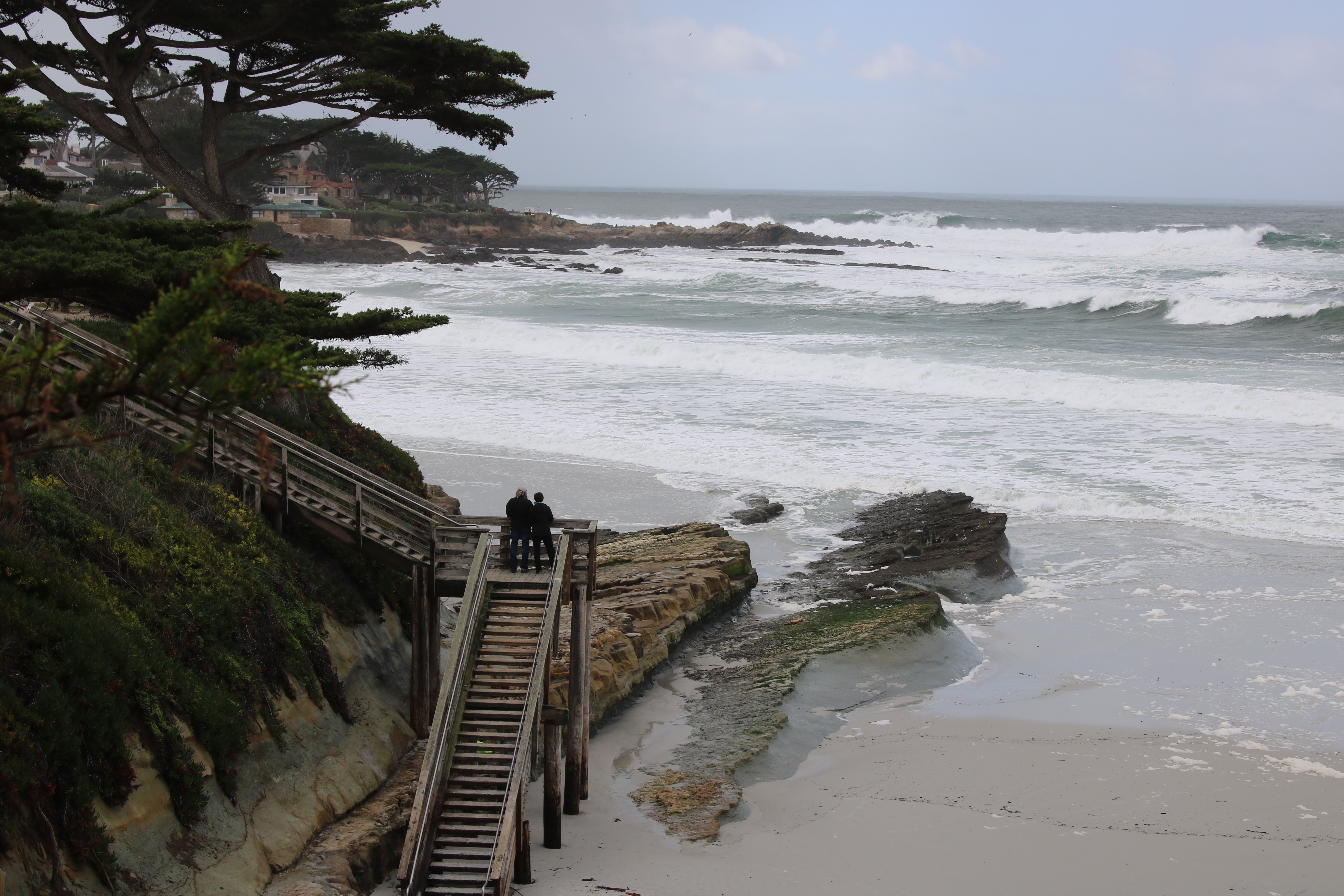 Couple on stairs at the beach